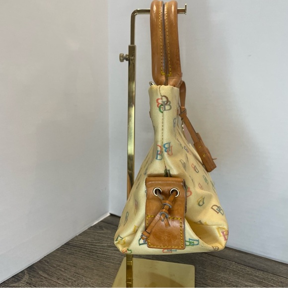 Dooney & Bourke Cream Satchel Bag pre-owned. Strap has stain. - Picture 4 of 16